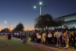A long line forms outside the stadium